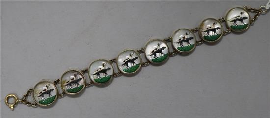 A gilt metal and reverse intaglio dog bracelet, length 20cm